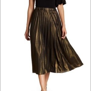 Long gold pleated skirt